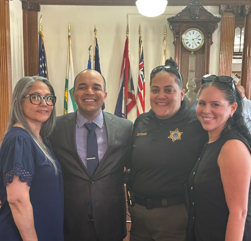 Genesis Arias, third from right, is pictured from left, with her mother, Leomaris Perez; her cousin, Sgt. Gregory Perez of the Wilkes-Barre City Police Department, and her wife, wife Ashley Swan, during her cousin's swearing-in ceremony in June.