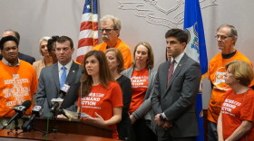 Stacey Mayer, from Moms Demand Action, stands beside Rep. Steven Stafstrom to support the legislative session's Red Flag proposal.