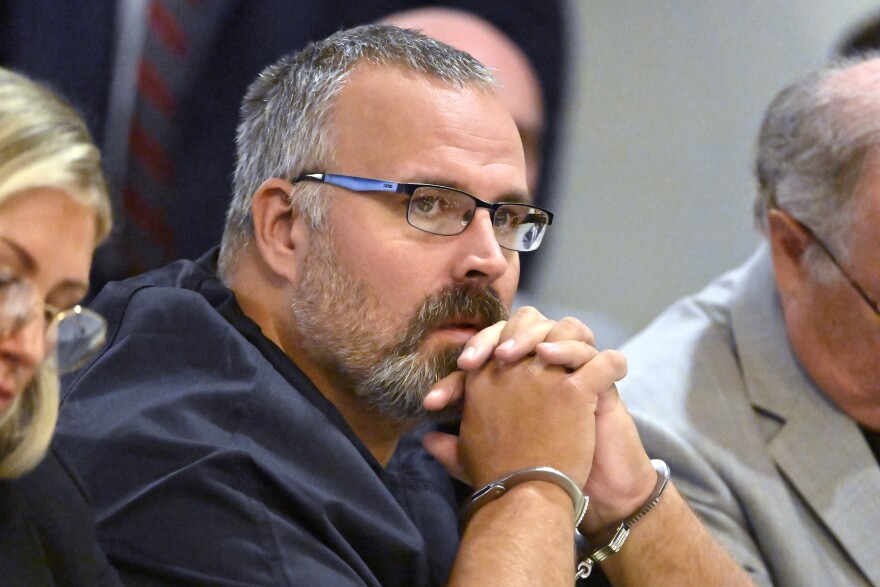 FILE - Former Letcher County Ky. Sheriff Shawn "Mickey" Stines, accused of killing District Judge Kevin Mullins, looks at a witness during testimony at the Morgan County Courthouse in West Liberty, Ky., Oct. 1, 2024.