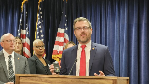 Rep. Mike Schietzelt, R-Wake, holds an ignition interlock device that's used to keep drunk drivers from starting their cars.