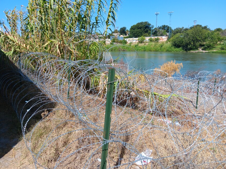 Operation Lone Star razor wire lines the banks of the Rio Grande near Eagle Pass.