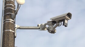 An automated license plate reader produced by the company Avigilon sits on a poll in downtown Saginaw