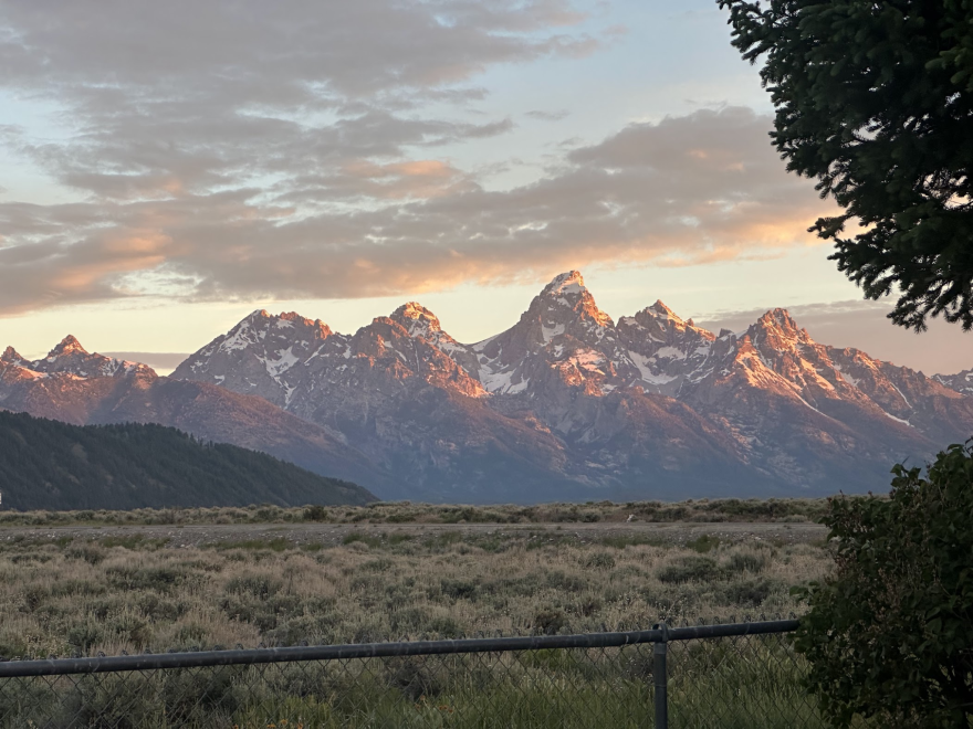 Mountains rise behind the plains.