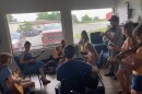 Instructors Ashlee Watkins (left) and Andrew Small lead a group of young musicians through an old-time song during the Floyd JAMS summer camp.