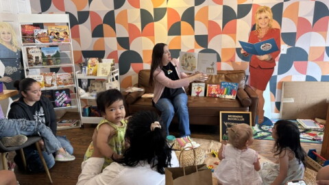 Jessica Knight reads to the children that participated in the Morning Book Club and Poetic Republic, a coffee shop in Southtown. Imagination Library sponsored the gathering.