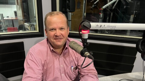 Ryan McCrady in NPR Illinois Studios at microphone.