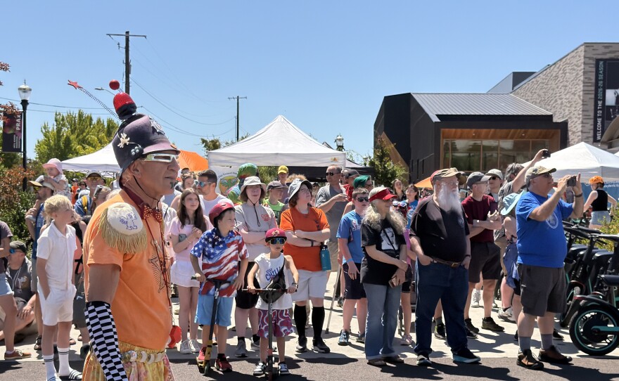 A crowd and one of the Kinetic Kops wait to watch the start of The Graand Kinetic Challenge, July 18, 2026.