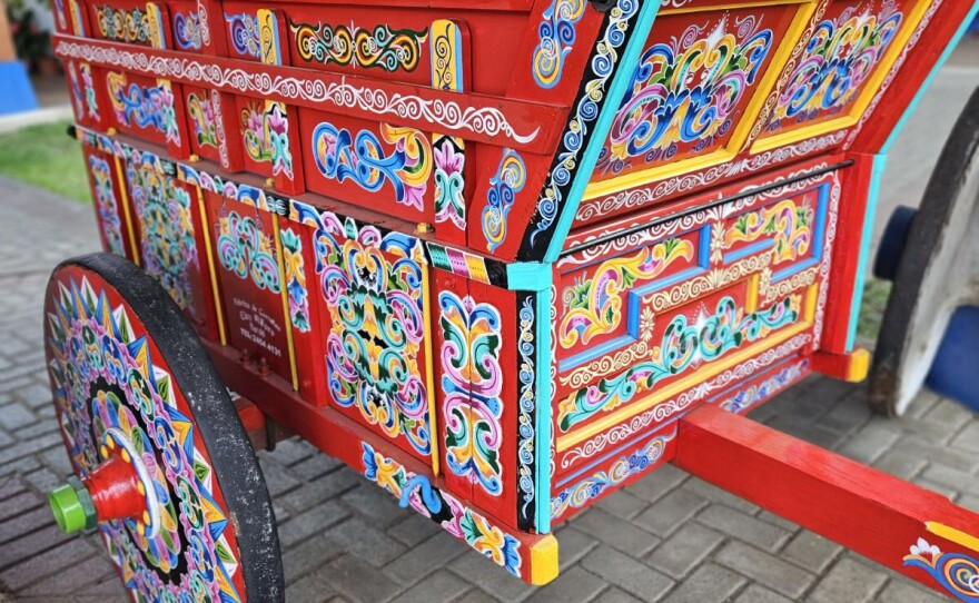 A traditional Costa Rican ox cart with vibrant decoration.