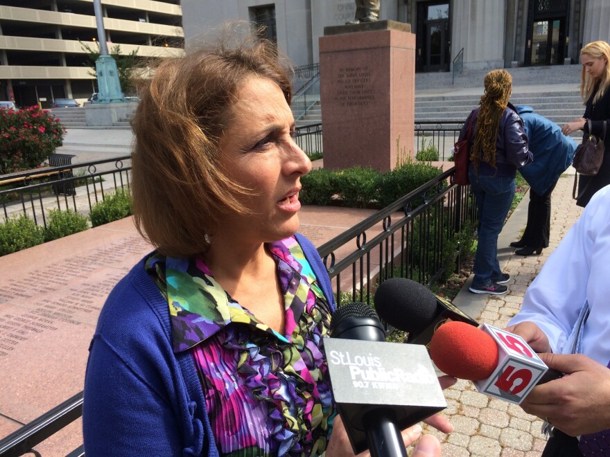 Spencer Fane attorney Jane Dueker talks to reporters after arguing against the legality of St. Louis' minimum wage law. Dueker is representing a coalition of businesses and business groups seeking to strike the law down.