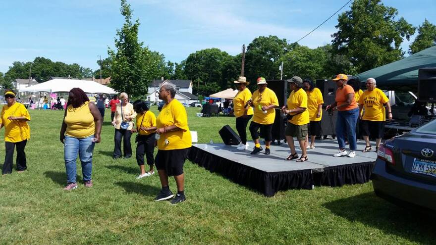 People dance onstage at last year's Juneteenth Festival.