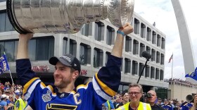 St. Louis Blues captain Alex Pietrangelo raises the Stanley Cup above his head during the downtown championship celebration.