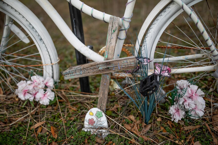 A ghost bike memorial for Megan McClellan stands at the site where she was killed riding her bike on 17th Street in 2017.