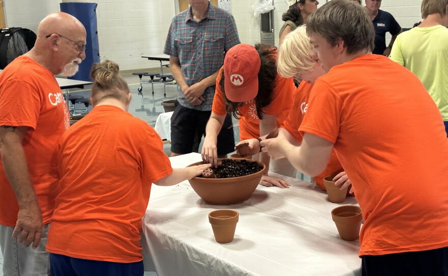 Campers made their own potted plants from an assortment of different soils and materials Tuesday at Camp Sight.