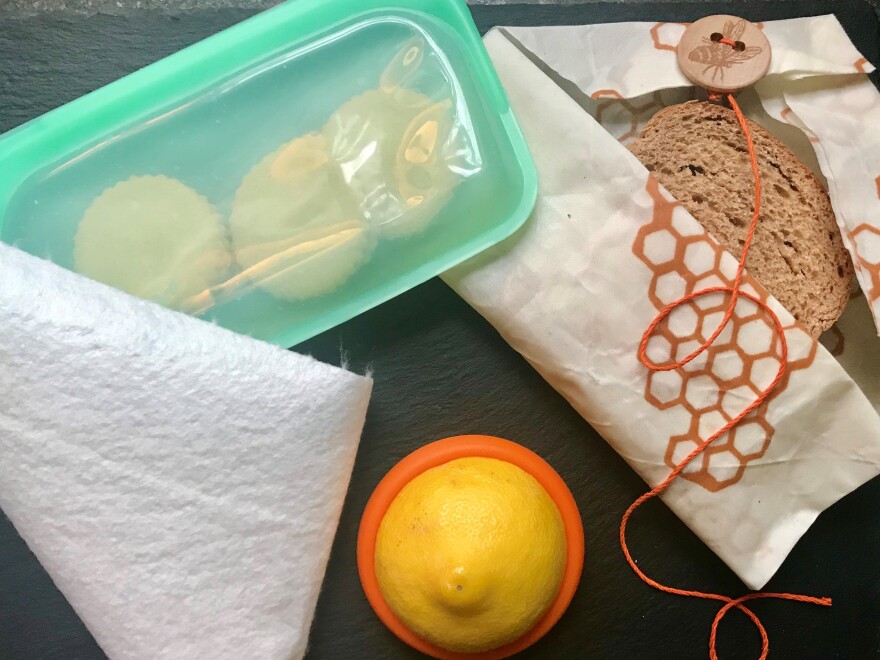 Last year, the author set about reducing her reliance on single-use disposables in the kitchen. Above are some of the tools she has adopted for food storage: a heavy-duty reusable silicone zip-top bag, bamboo towels, silicone disks that slip over the ends of cut pieces of fruits and vegetables, and beeswax-covered fabrics.