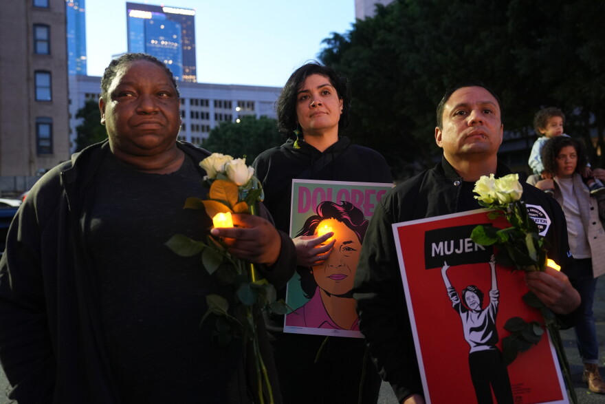 People attend a vigil to honor Dolores Huerta, a labor organizer whose advocacy improved conditions for migrant farm workers, Wednesday, Oct. 28, 2026, in Los Angeles.