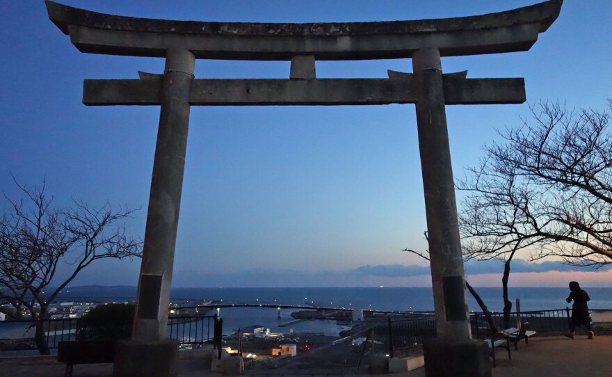 A Shinto Torii gate sits atop a hill in Ishinomaki, where 3,700 drowned in the 2011 tsunami. Many fled to the hilltop to survive.