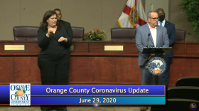 Dr. Raul Pino (r) briefs the media. Image: Orange TV