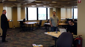 Chuck Stormon, left, checks on last-minute preperations before the StartFast Venture Accelerator starts Monday in Syracuse.
