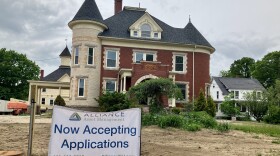 A sign for applications to move into affordable housing in front of the Gafney Home, in Rochester.