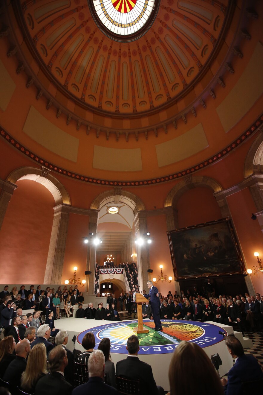 A packed Statehouse Rotunda watch Gov. Mike DeWine deliver his inauguration address.
