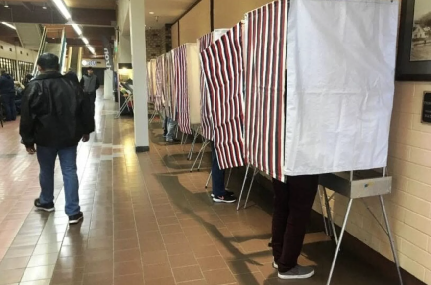 Voters mark their ballots at Ketchikan’s Precinct No. 2 at The Plaza on Nov. 6, 2018.