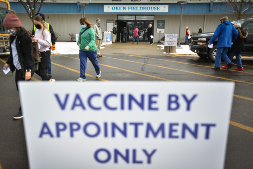 Johnson County residents visit Okun Fieldhouse in Shawnee where COVID-19 vaccinations started in January.