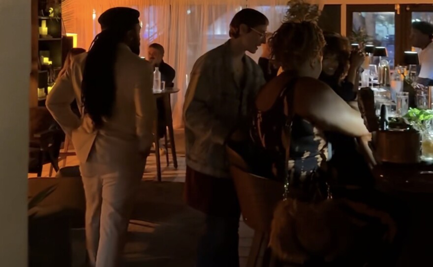 Co-founders Horace and Elizabeth Henry speaking with guests at Off The Clock, a new restaurant, listening bar, art gallery, and creative third space in Downtown Lake Worth Beach