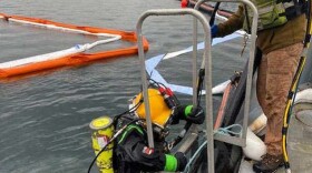 Oil spill response to the sunken Saint Patrick in Womens bay.