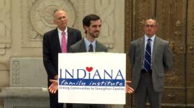 Former Brownsburg teacher John Kluge, joined by his lawyers, speaks to the press announcing the lawsuit Wednesday.