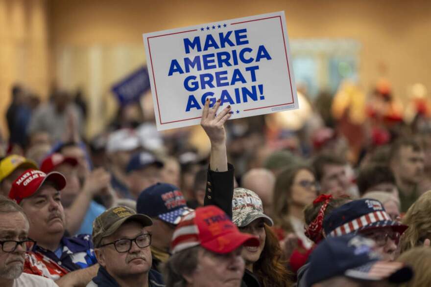 A Trump supporter holds up a MAGA sign during a rally for Republican presidential candidate, former President Donald Trump, in Green Bay, Wis., April 2, 2024. (Mike Roemer/AP)
