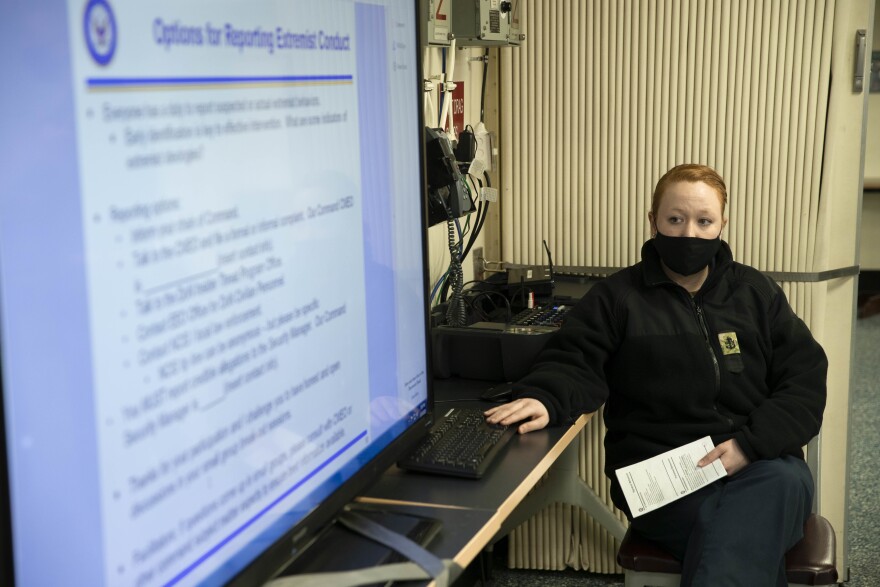 Chief Personnel Specialist Jennifer Johnston conducts an extremism stand down March 19 aboard the USS Gerald R. Ford. The Pentagon ordered all service branches to conduct the stand downs after the Jan. 6 Capitol insurrection.