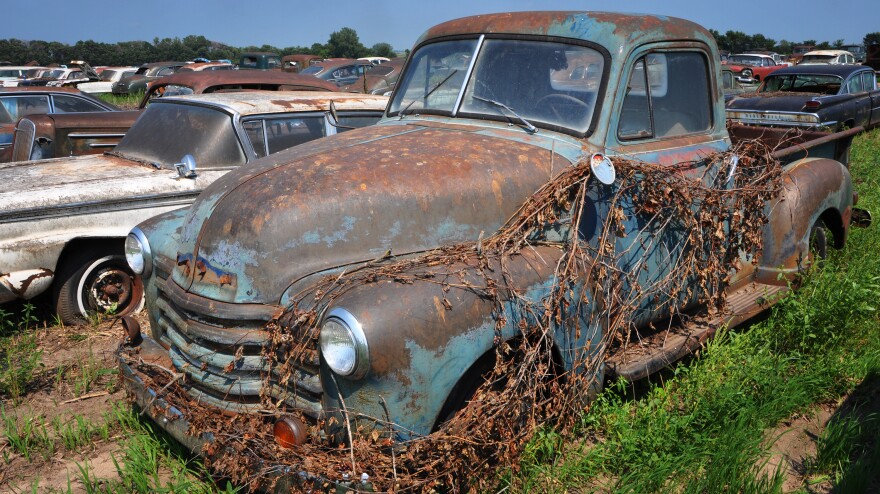 The owner of the dealership wouldn't sell trade-ins or the previous year's model once the new ones came out, keeping most of the old inventory outside. He closed his dealership in 1996 and is just now selling off his collection.