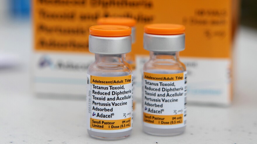 Vials of Tdap vaccine sit on a table at a Solano County, Calif., health fair in August 2010.