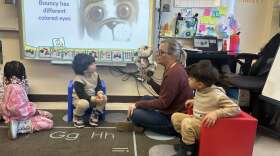 Adrien Fell working with students at DeKalb's Early Learning Development Center
