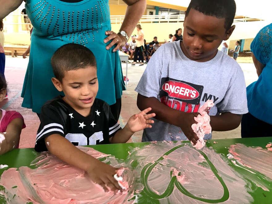 Hearts are popular with the kindergarteners, while third-graders finger painted more houses.