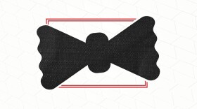 A black bowtie on a white and red background