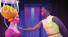 Swan reaches her arm out to touch animated Coppelia