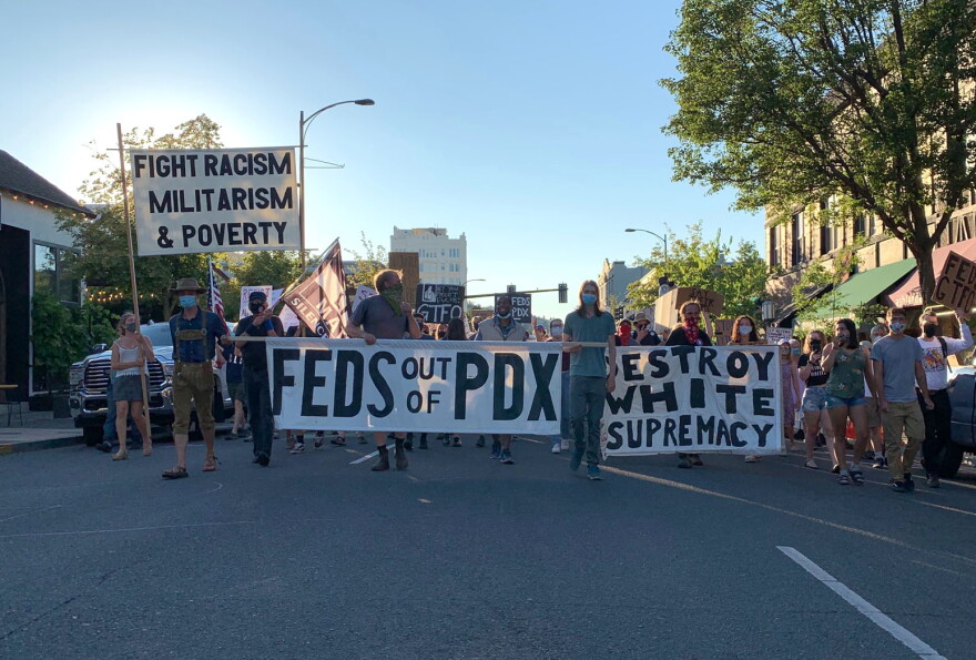 Protesters march down Main Street in Ashland in solidarity with Portland demonstrations. 