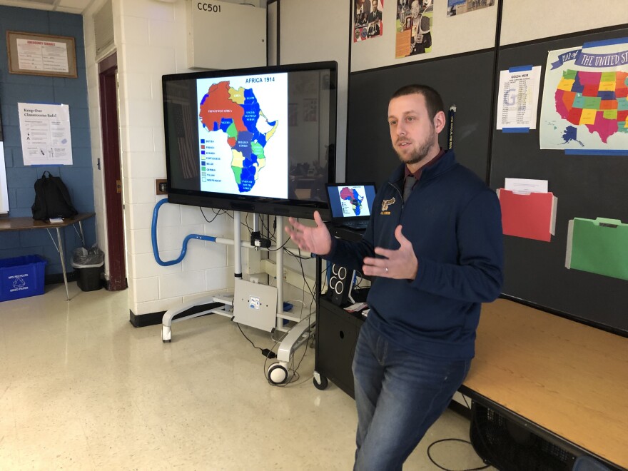 Teacher Alex Janke displays a map of colonial Africa in 1914, to set the context for a Marcus Garvey speech students were about to read.