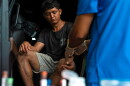 A participant watches as a nurse prepares to draw blood for the CURE study in Usulutan, El Salvador.