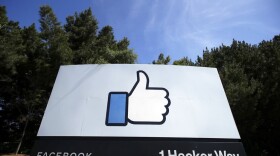 The thumbs up Like logo is shown on a sign at Facebook headquarters in Menlo Park, Calif. (AP Photo/Jeff Chiu, File)