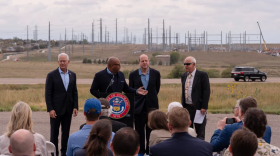 From left to right, U.S. Department of Energy Assistant Secretary for the Office of Environmental Management Timothy J. Walsh, Xcel Energy President Robert Kenney, Gov. Jared Polis and Colorado Energy Office Executive Director Will Toor attend a press conference on Thursday, Sept. 24, 2026, in Aurora. The Department of Energy announced a $250 million federal award to fund upgrades to Colorado’s electricity grid, increasing transmission capacity and helping meet the state’s growing demand for power.