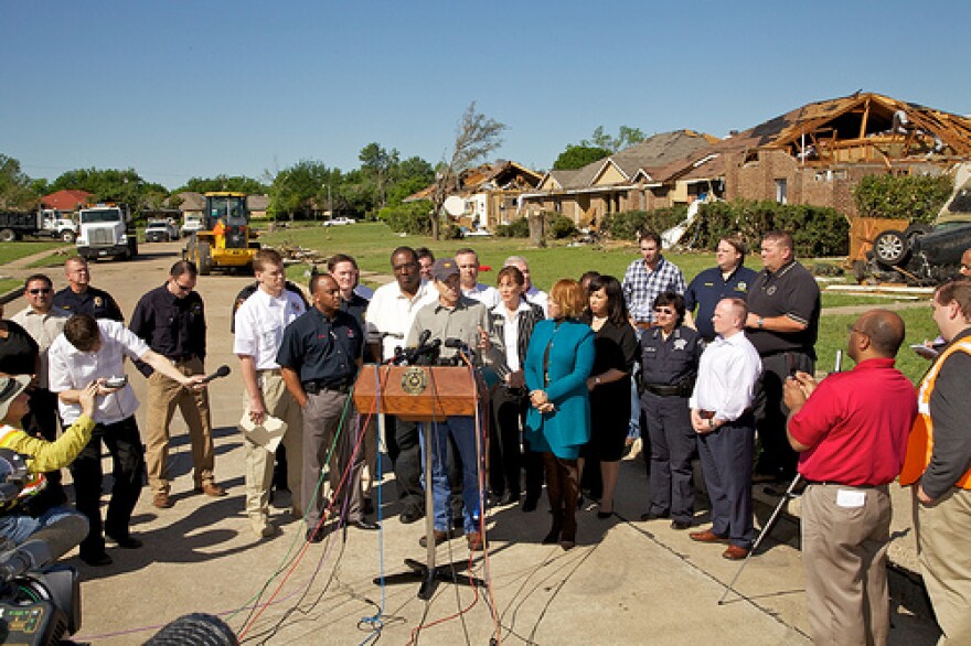 Governor Rick Perry speaks at a press conference in Lancaster after touring tornado damage.