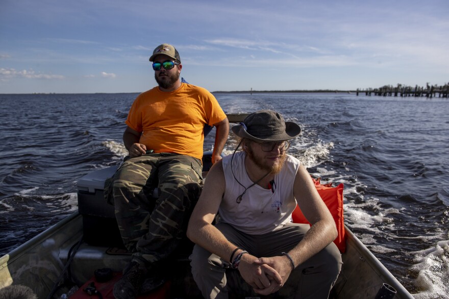 With no roads passable. Dalton Wells and Jacob Stevens volunteered their boat to ferry people back and forth to Matlacha and Pine Island on Monday.