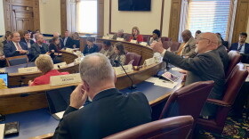House Ways and Means Chair Tim Brown (R-Crawfordsville), right, discusses the surplus spending bill in committee.