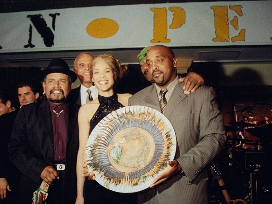 Rice celebrates a gang truce with Nana Alejandres and Bo Taylor, two chieftains who became friends. In the background: activist Harry Belafonte and former NFL great turned activist Jim Brown, whose Amer I Can Foundation works with gangs.