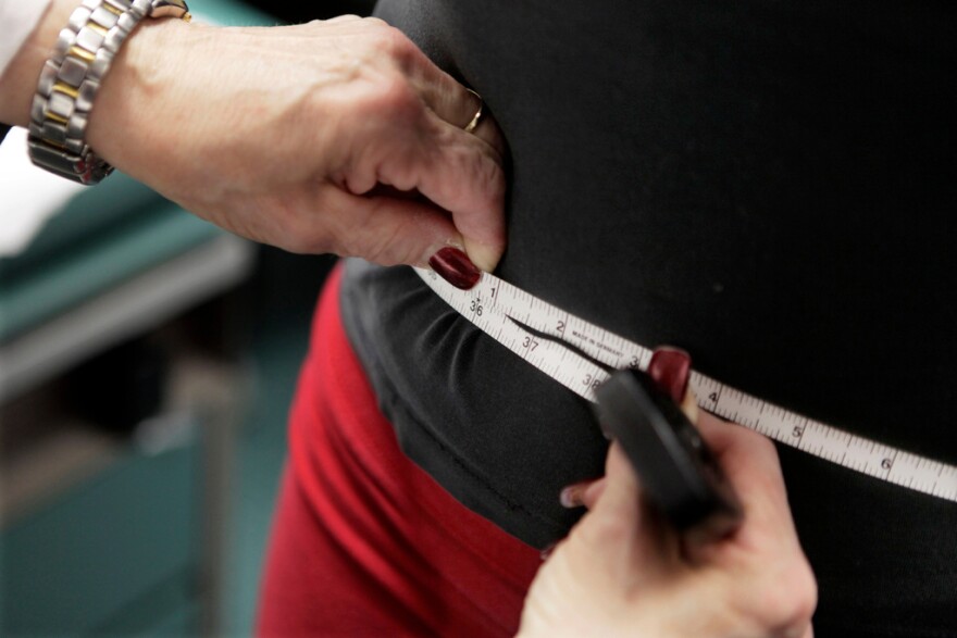 A subject's waist is measured during an obesity prevention study in Chicago on Jan. 20, 2010. (AP Photo/M. Spencer Green, File)