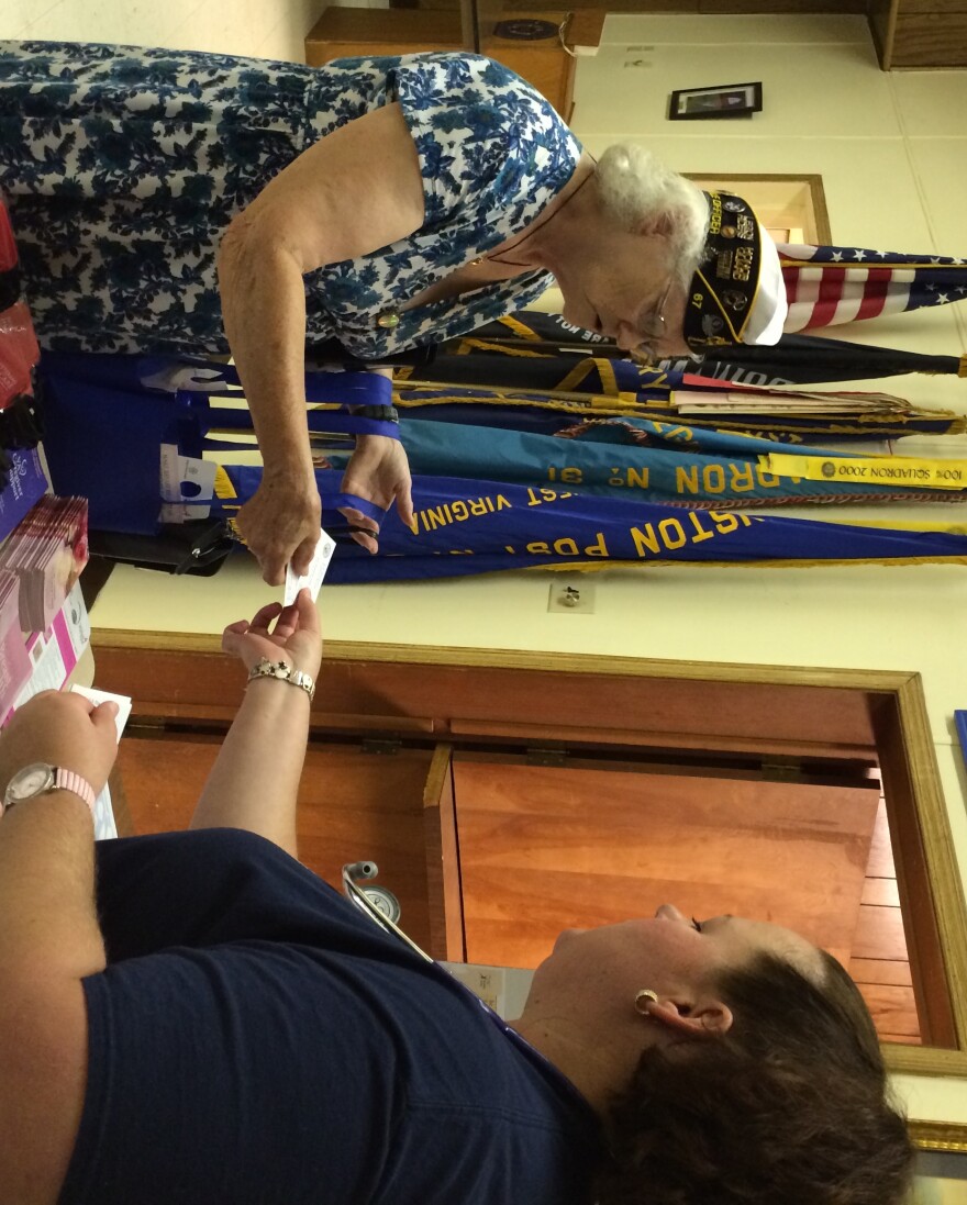 Donna Peter, Service Officer for American Legion Post 67 and the 4th District receives information from Heather Zickefoose, LPN with the VA's Mobile Health Unit.