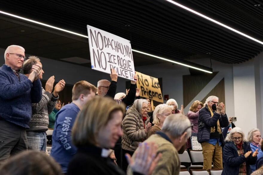 Protesters cheer after Rockingham County commissioners voted to table an ICE detainee contract indefinitely on Feb. 5, 2026.