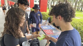 College students pass out Plan B to educate young voters at Florida Atlantic University on Thursday, April 11, 2024, in Boca Raton, Fla. Abortion and marijuana will be on Florida's November ballot, and these issues are critical issues for young voters.